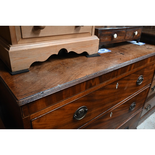 56 - A George III mahogany chest of three long graduated drawers, bone escutcheons, raised on shaped brac... 