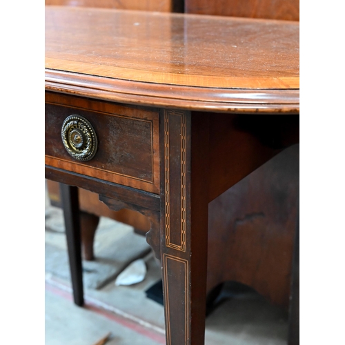 78 - An Edwardian mahogany hall table with crossbanded oval top over a frieze drawer raised on tapering s... 