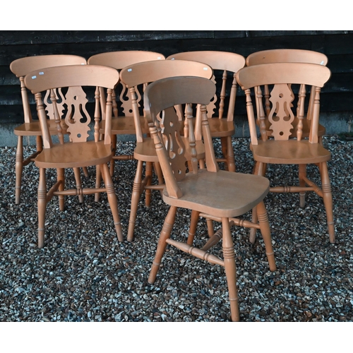 126 - A set of eight vintage beech dining chairs with fret cut backs and turned legs