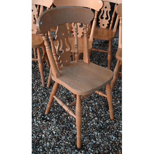 126 - A set of eight vintage beech dining chairs with fret cut backs and turned legs