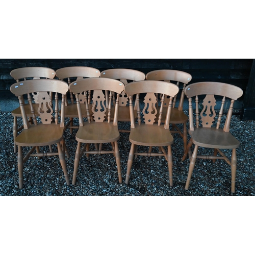 126 - A set of eight vintage beech dining chairs with fret cut backs and turned legs