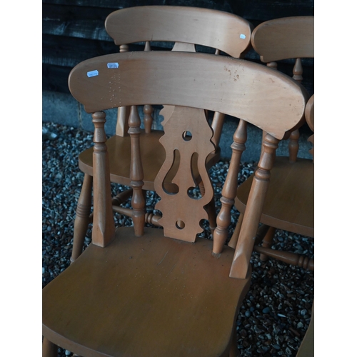 126 - A set of eight vintage beech dining chairs with fret cut backs and turned legs