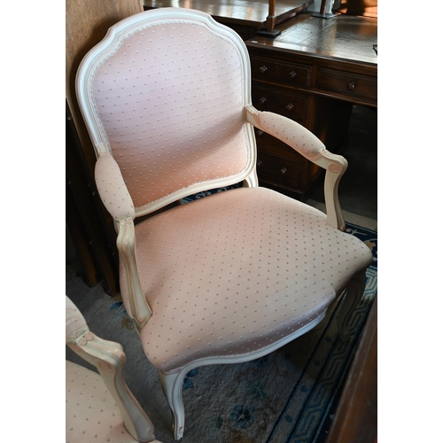 131 - A pair of French painted fauteuil open armchairs with patterned pink fabric