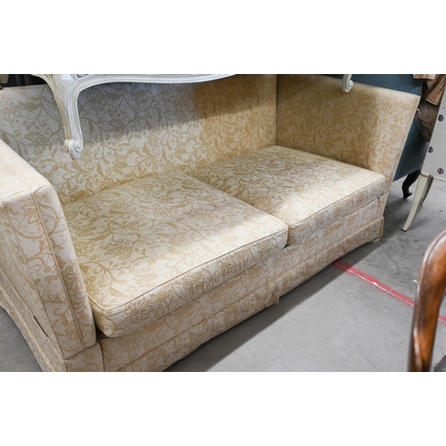 150 - A Knole two-seater sofa with old gold floral upholstery and turned hardwood finials, 192 x 90 x 100 ... 