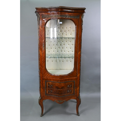 101 - A continental brass mounted kingwood serpentine form salon display cabinet, the interior with button... 