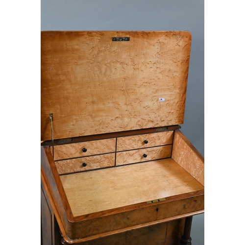 104 - A Victorian walnut Davenport desk, with hinged stage-back enclosing stationary compartments over a m... 