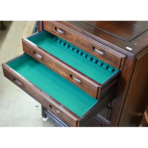 112 - # A vintage Chinese stained hardwood cutlery cabinet with five baize lined drawers over panelled cup... 