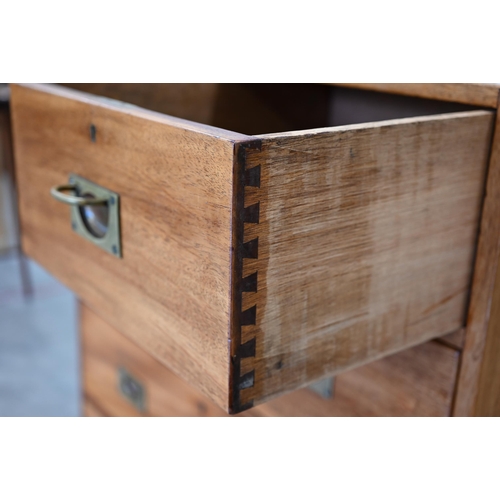 113 - A teak two-section campaign style chest with two short and three long drawers with brass handles, 92... 