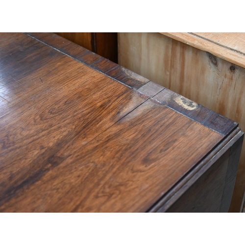 114 - A Regency crossbanded rosewood and brass inlaid sofa table with two drawers and opposing dummy drawe... 