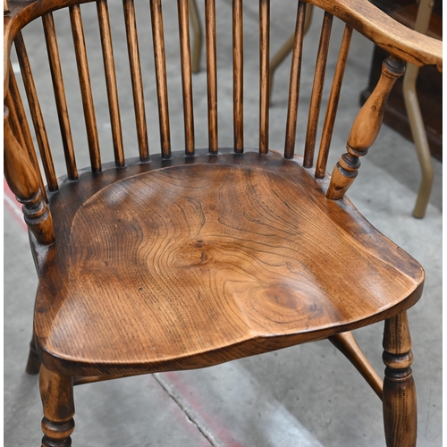 115 - A ash and elm Windsor armchair with turned legs and crinoline stretcher