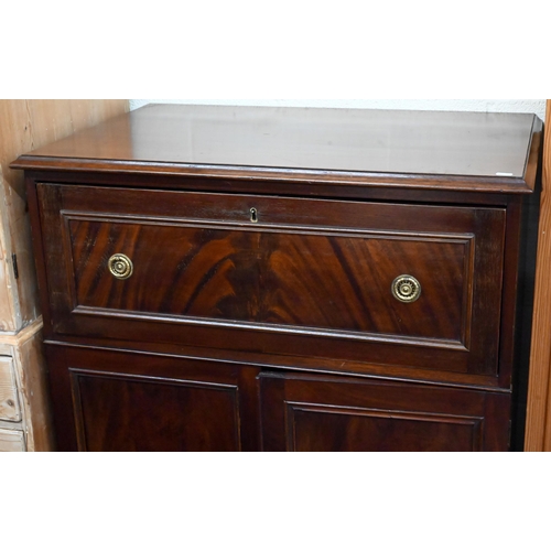 122 - A 19th century mahogany secretaire cabinet, the drop-front drawer with fitted interior over a pair o... 