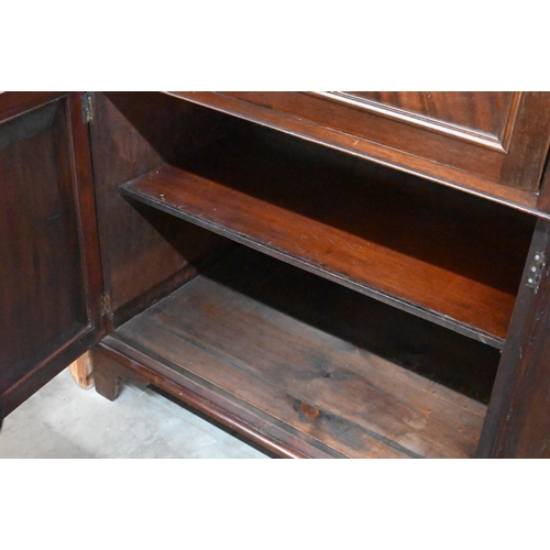 122 - A 19th century mahogany secretaire cabinet, the drop-front drawer with fitted interior over a pair o... 