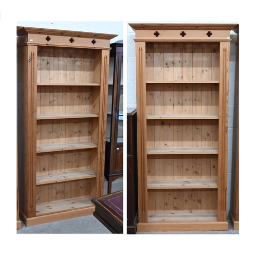 123 - A pair of modern stained pine open bookcases each with four fixed shelves, 90 cm w x 30 cm d x 182 c... 