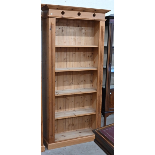 123 - A pair of modern stained pine open bookcases each with four fixed shelves, 90 cm w x 30 cm d x 182 c... 