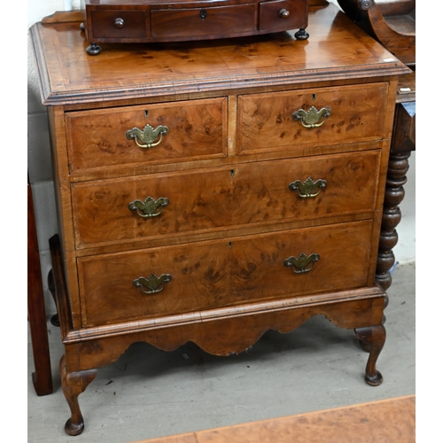 130 - An antique walnut feather banded chest on stand with two short and two long drawers, shaped apron an... 