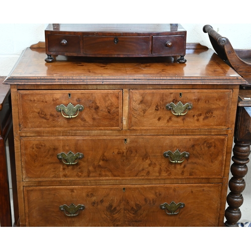 130 - An antique walnut feather banded chest on stand with two short and two long drawers, shaped apron an... 