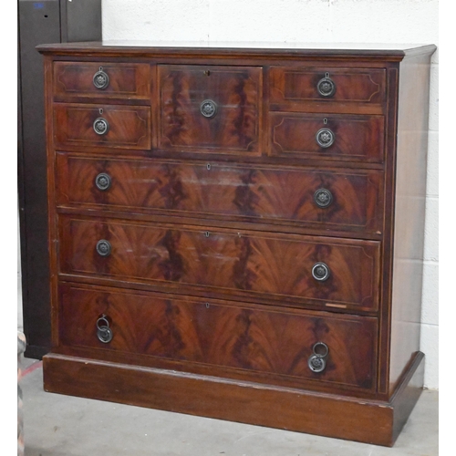 134 - A large 19th century crossbanded mahogany and boxwood strung chest of drawers, the central deep hat ... 