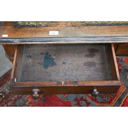 155 - A Victorian oak writing table with gilt tooled leather top and two drawers raised on turned fluted s... 