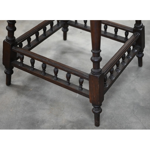 156 - An early 20th century oak and parquetry inlaid octagonal table on turned supports united by spindled... 