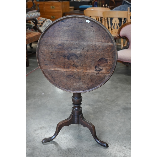 159 - A 19th century oak occasional table with circular tilt-top raised on a turned column and triform sup... 