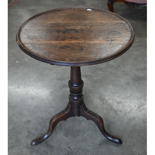 159 - A 19th century oak occasional table with circular tilt-top raised on a turned column and triform sup... 