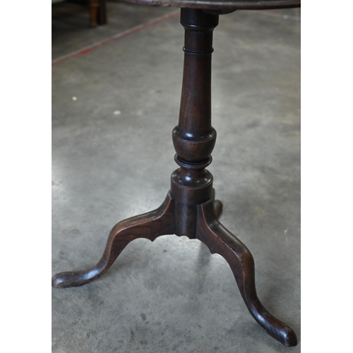 159 - A 19th century oak occasional table with circular tilt-top raised on a turned column and triform sup... 