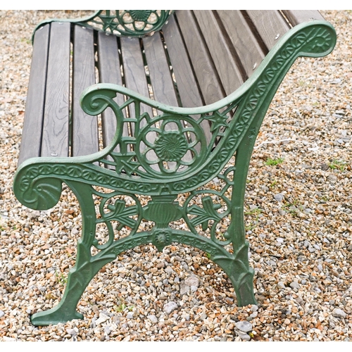 16 - A Victorian style two seat garden bench with cast iron ends and teak slats