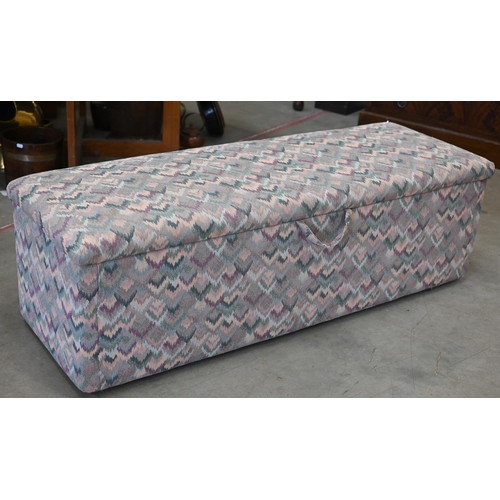 165 - A vintage ottoman upholstered in 'Aztec' fabric in pastel colours, 146 cm w x 50 cm d x 48 cm h