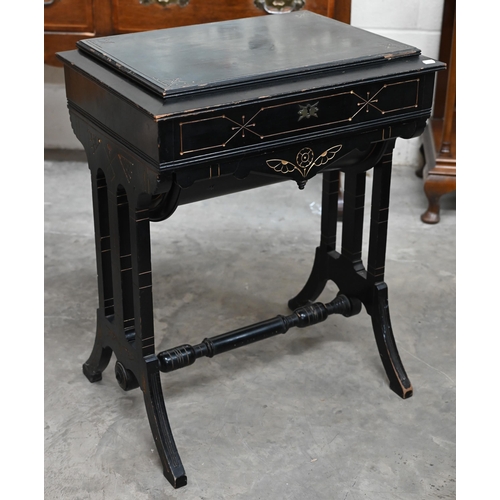 170 - A Victorian Aesthetic period ebonised work table, the hinged top fitted with underside mirror enclos... 