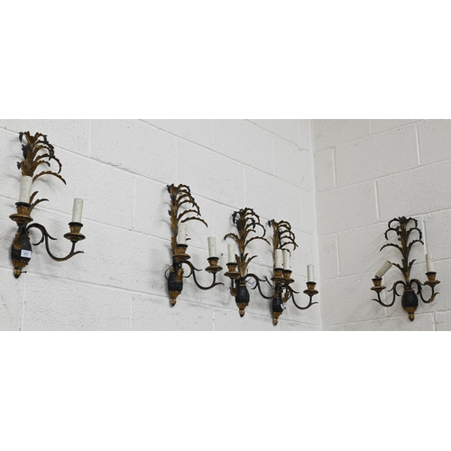 171 - Five Italianate black and gilt metal twin-branch wall lights, 50 cm high