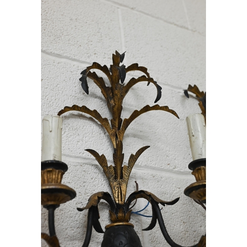 171 - Five Italianate black and gilt metal twin-branch wall lights, 50 cm high