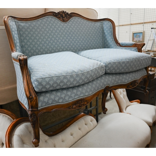 178 - An early 20th century French salon settee with carved walnut frame, re-upholstered in blue imbricate... 