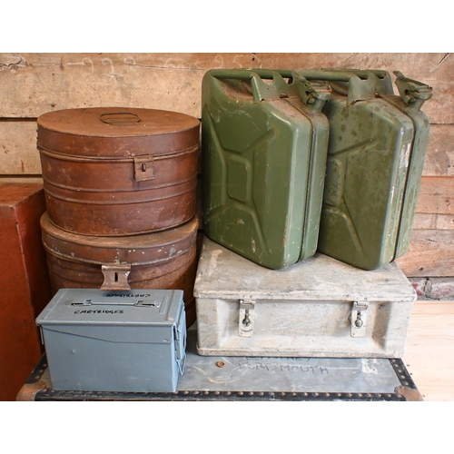 18 - Two military style green 20L jerry cans, one Sendrik, one Waviey to/with an old cartridge case; a gu... 