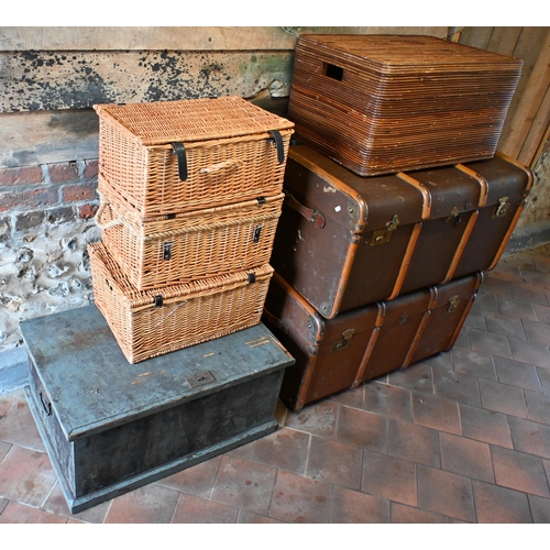 19 - Three various wicker hampers, to/with a wicker box seat, two vintage brass bound trunks and a staine... 