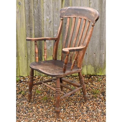 22 - An antique elm-seated Windsor chair, stamped 'GG'