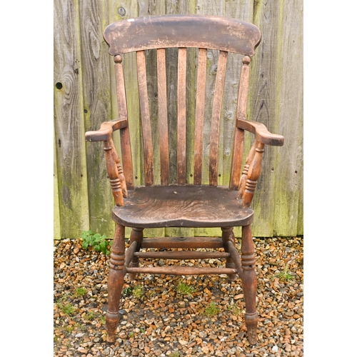 22 - An antique elm-seated Windsor chair, stamped 'GG'