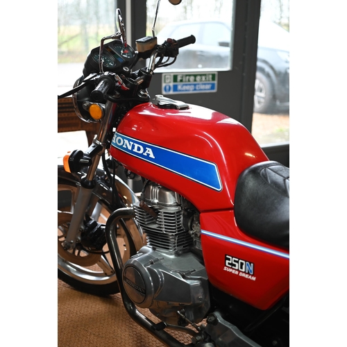 25 - A modern classic Honda 250N Super Dream motorcycle, 1982, reg. DGK 968X, red/chrome, showing 43,214 ... 