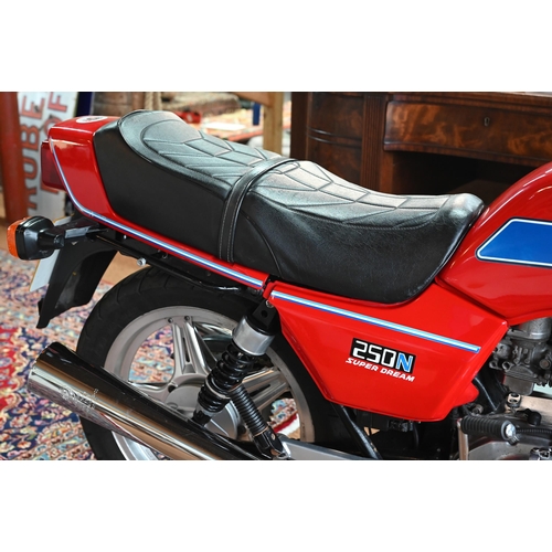 25 - A modern classic Honda 250N Super Dream motorcycle, 1982, reg. DGK 968X, red/chrome, showing 43,214 ... 