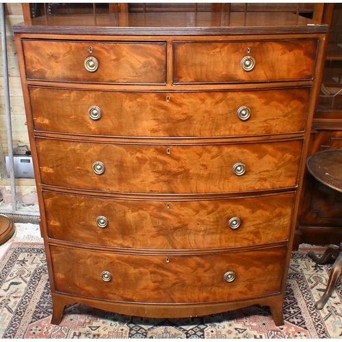 26 - A 19th century mahogany bowfront chest of two short over three long graduated drawers, raised on spl... 