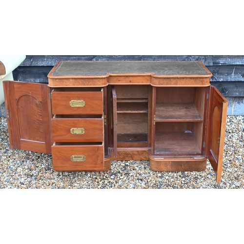 27 - A Victorian figured walnut inverted breakfront kneehole desk, with green leather skiver, raised on p... 