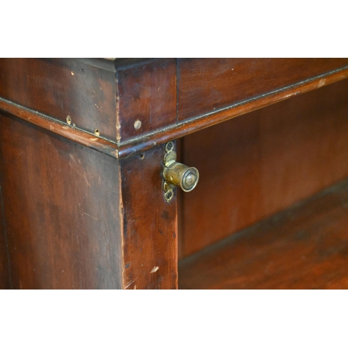 28 - An antique satinwood low open bookcase, with adjustable shelves on a plinth base