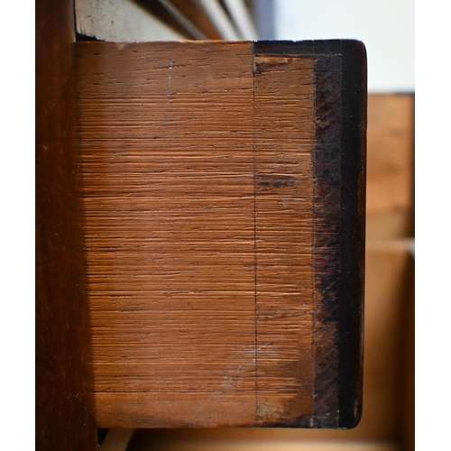 34 - A Victorian mahogany chest of six deep graduated drawers, with turned fittings and raised on a plint... 