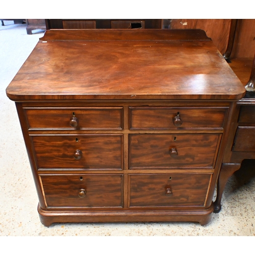 34 - A Victorian mahogany chest of six deep graduated drawers, with turned fittings and raised on a plint... 