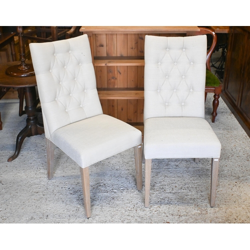 38 - A pair of contemporary Marks & Spencer's brand linen button backed chairs with limed oak legs to... 