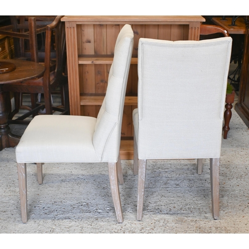 38 - A pair of contemporary Marks & Spencer's brand linen button backed chairs with limed oak legs to... 