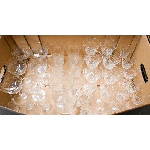 385 - A suite of cut and etched drinking glasses with water jug (box)