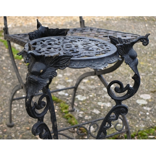 4 - A weathered Victorian style folding circular terrace table and two chair set, to/w a metal pot stand... 