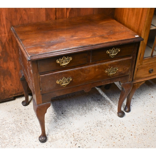 42 - An 18th century walnut three drawer side table, raised on cabriole legs, later brass fittings and a/... 