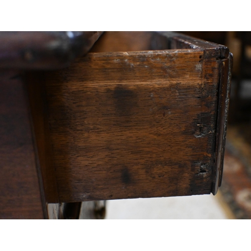 42 - An 18th century walnut three drawer side table, raised on cabriole legs, later brass fittings and a/... 