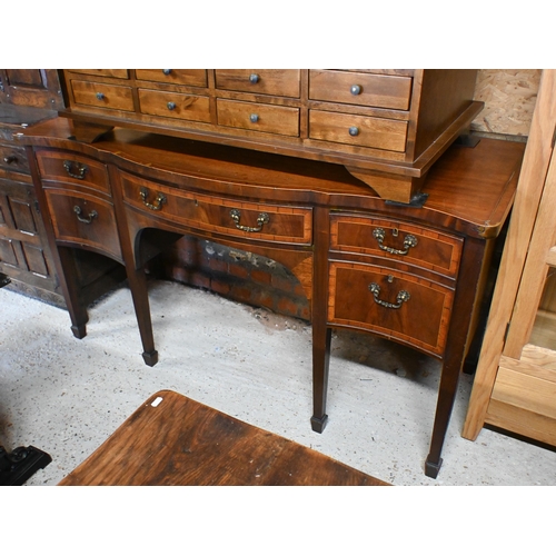 48 - A George III cross-banded bowfront satinwood sideboard, centred by a drawer flanked by a twin dummy ... 